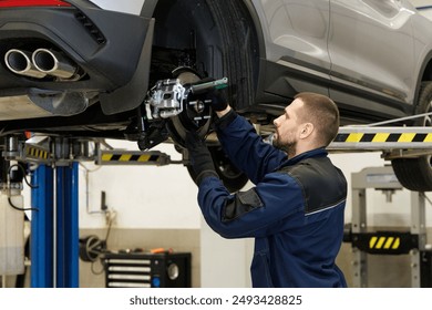 Brake pad repair, car on a lift, close-up. A modern car in a car service on a lift with a wheel removed. Elements of the brake system and suspension - Powered by Shutterstock