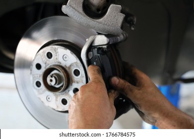 Brake pad replacement in car service - Shutterstock ID 1766784575