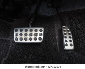 Brake pedal and accelerator pedal in car , close up