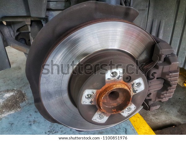 Brake system of car, Closeup disc brake of the
vehicle for repair in
garage