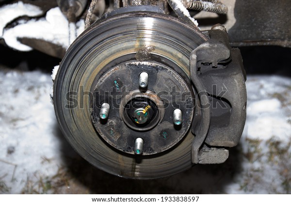 Braking system with disk open for\
repair maintenance and service. Close up disk brake of\
car.