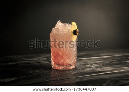 Bramble in an Old fashioned glass in black backdrop