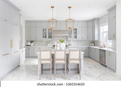 Brampton, Ontario / Canada -  March 5, 2019: A Modern White Kitchen With A Traditional Touch Custom Designed By Toronto Interior Designer Jessica Mendes.