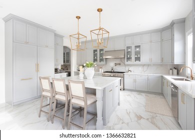 Brampton, Ontario / Canada - March 5, 2019: A modern white kitchen with a traditional touch custom designed by Toronto interior designer Jessica Mendes.