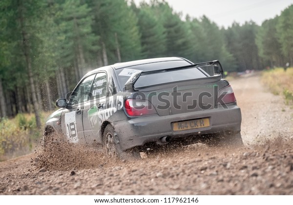 BRAMSHILL\
FOREST, UK - NOVEMBER 3, 2012: Over-steer by Mike Harris driving a\
Subaru Impreza on the Warren stage of the MSA Tempest Rally in\
Bramshill Forest, UK on November 3,\
2012