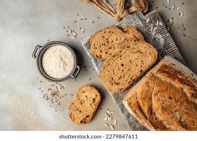 bran bread with different seeds pumpkin, poppy, flax on wooden board, banner, menu, recipe place for text, top view, - Powered by Shutterstock