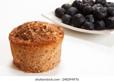 Bran Muffin Isolated On White With Blueberries