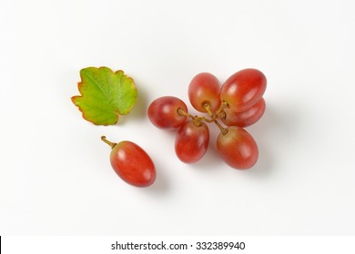 Branch Of Red Grapes On White Background