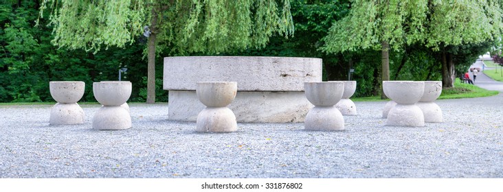 brancusi the table of quiet is built from granite originally the twelve chairs were much closer to the table and were arranged in pairs brancusi white outdoor outside sculpture romania statue panorama