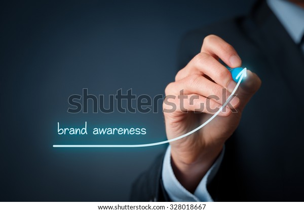 Brand awareness improvement\
concept. Brand manager draw growing graph with text brand\
awareness.\
