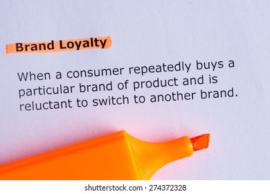 brand loyalty word highlighted on the white paper