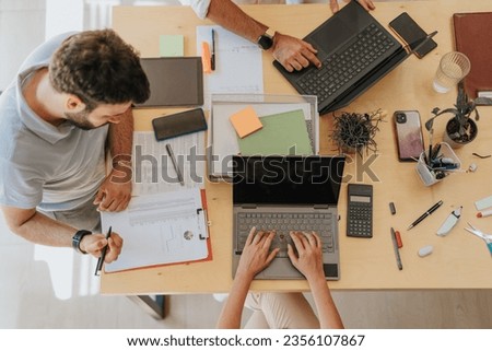 Brand management professionals collaborating in an office,