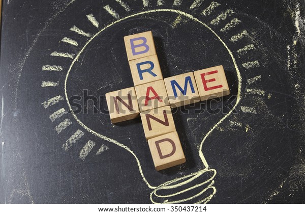 Brand\
Name Crossword with wooden block on the\
blackboard