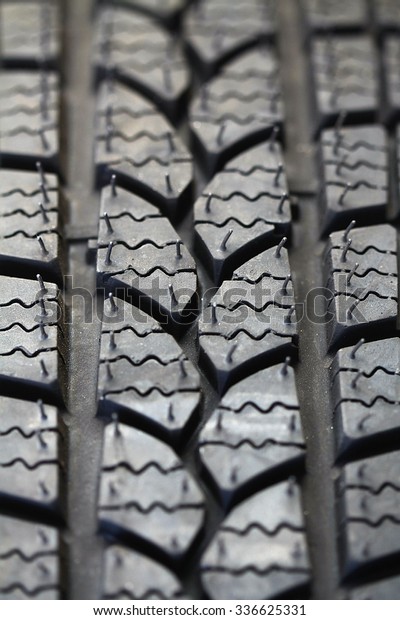 Brand new car tire\
background.