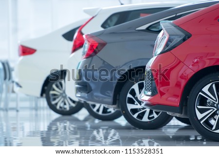 Brand new cars in stock Showroom floors are epoxy for parking in new car showrooms for sale at car dealerships.