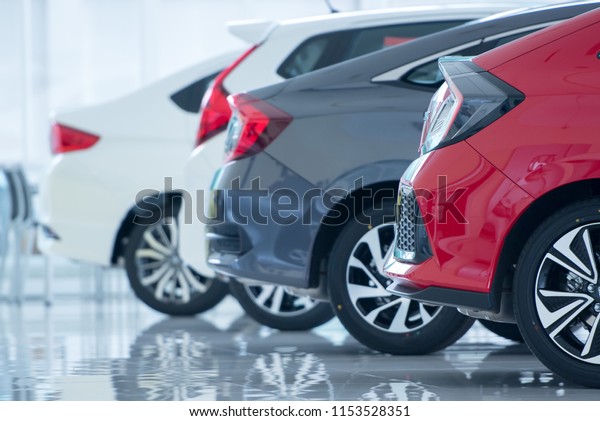 Brand new cars in\
stock Showroom floors are epoxy for parking in new car showrooms\
for sale at car\
dealerships.