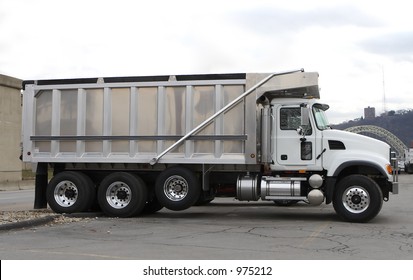 Brand New Dump Truck At Truck Dealer Lot.