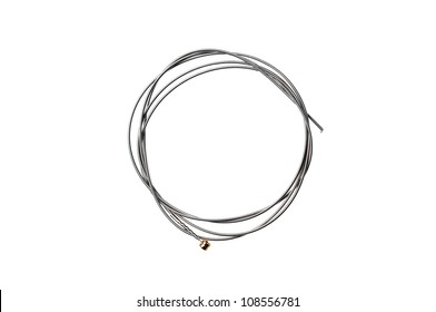 Brand new guitar string, isolated on white.