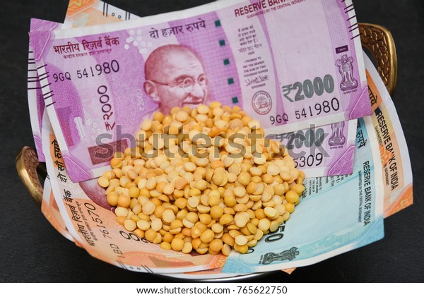 The brand new Indian currency bank notes of 200,\
50 and 2000 rupees bundle. Success and got profit from business.\
GST tax on goods and service. Rise in price of food grocery, pulses\
affect poor people