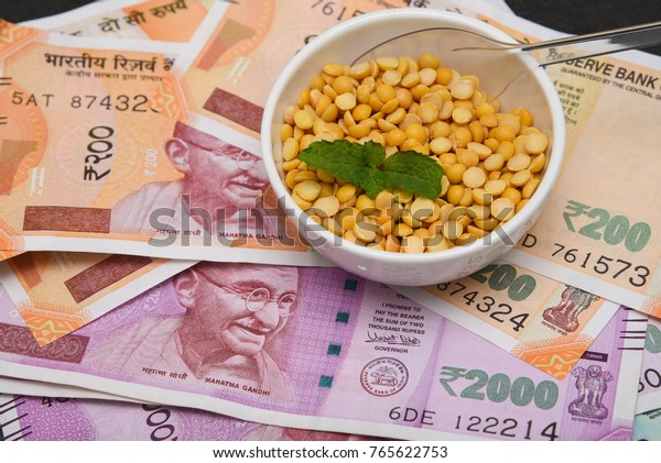 The brand new Indian currency bank notes of 200,\
50 and 2000 rupees bundle. Success and got profit from business.\
GST tax on goods and service. Rise in price of food grocery, pulses\
affect poor people