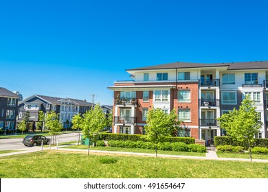 Brand New Low Rise Apartment Building On Sunny Day In British Columbia, Canada