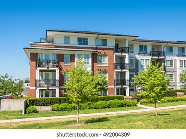 Brand New Low Rise Apartment Building On Sunny Day In British Columbia, Canada