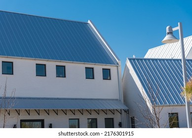 Brand New Metal Roof With Covered Gutter On Two Story Townhome Near Oklahoma City, US. Modern Design Of Residential House Urban Style With Front Porch Cover And Bay Windows Clear Blue Sky