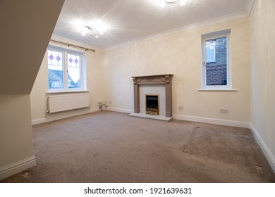 A Brand New Modern British Home Showing The Living Room With A Fire Place And Fire Place Mantle Place 