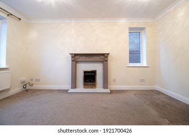 A Brand New Modern British Home Showing The Living Room With A Fire Place And Fire Place Mantle Place 