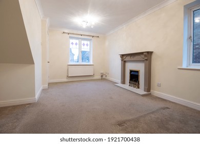 A Brand New Modern British Home Showing The Living Room With A Fire Place And Fire Place Mantle Place 