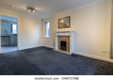 A Brand New Modern British Home Showing The Living Room With A Fire Place And Fire Place Mantle Place 