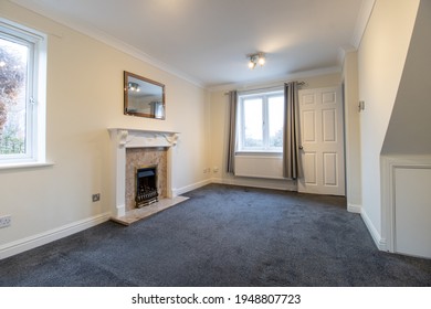 A Brand New Modern British Home Showing The Living Room With A Fire Place And Fire Place Mantle Place 