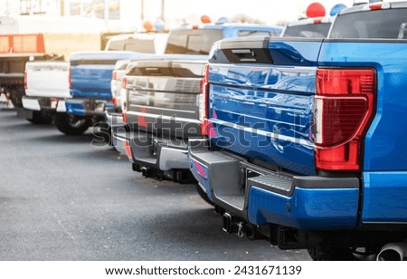 Brand New Modern Gasoline and Electric Pickup Trucks Vehicles on a Dealership Lot