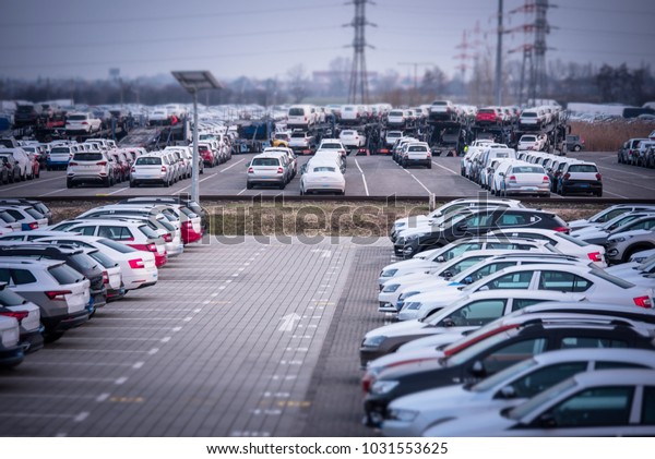 Brand new motor vehicles in a parking lot waiting
for export