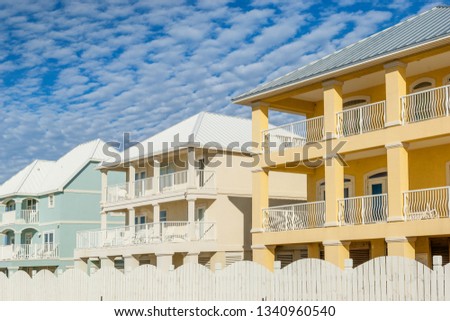 Brand new oceanfront multicolored vacation homes on the white sandy beach of Gulf of Mexico, Alabama, USA