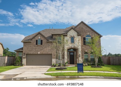Brand new two story residential house in suburban American neighborhood at Humble, Texas, US. Newly constructed, freshly built modern home with landscaped yard.