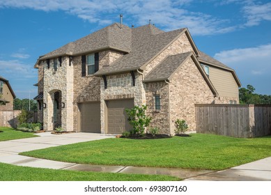 Brand new two story residential house in suburban American neighborhood at Humble, Texas, US. Newly constructed, freshly built modern home with landscaped yard.