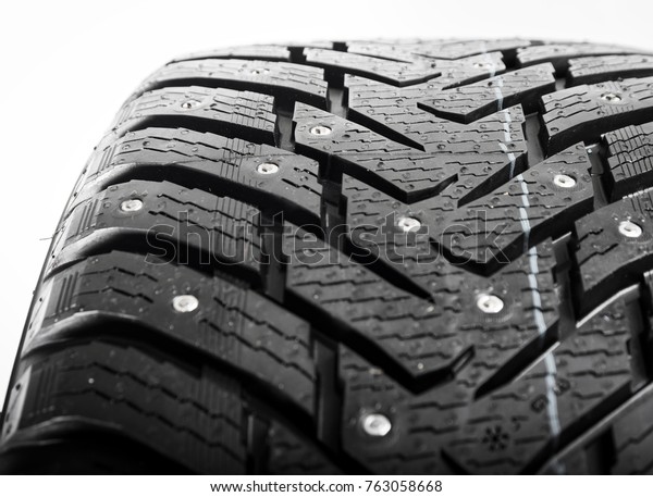 Brand new winter tires with a modern tread, close\
up details