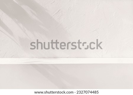 Brand product showcase template, blank neutral light beige podium stage with aesthetic lifestyle floral sun light shadows. White textured concrete wall and shelf background.