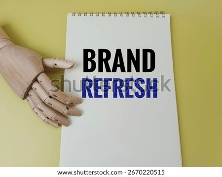 Brand Refresh concept with notebook, creative branding, logo update, marketing strategy, business planning, team collaboration, innovation ideas. 
