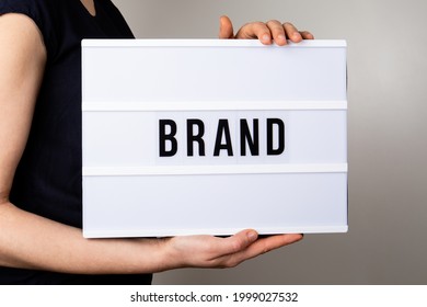 BRAND. Reliability, evaluation and development concept. Text in light box.