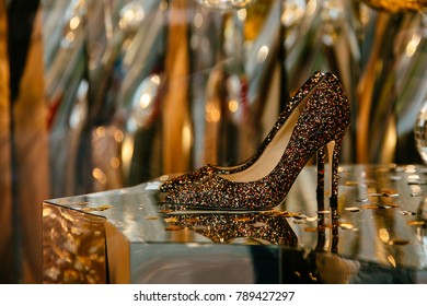 Brand women's store. Shiny shoes with rhinestones on showcase. - Powered by Shutterstock