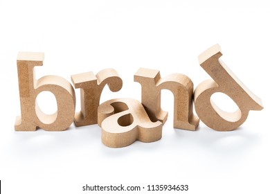 BRAND Wood Word Isolated On White Background, Brand Building, Brand Topic Concept