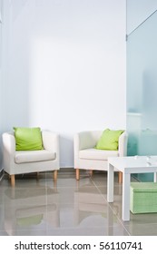 Brandable Waiting Room With Two Armchairs And White Wall On The Back.