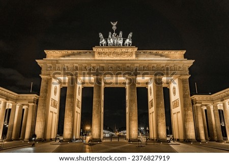 Brandenburg Gate in Berlin, Germany, light up at night casting long shadows from the east side - Front on