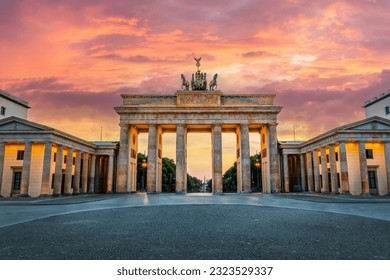 Brandenburg gate illuminated at sunset in Berlin, Germany