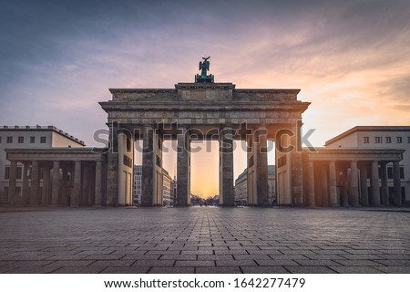 Brandenburg gate illuminated at sunset without people