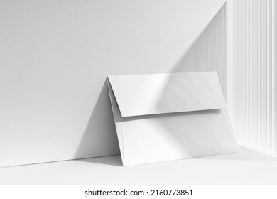 Branding envelope mockup template, with sharp natural shadows, real photo. Blank isolated on a white background to place your design. 
