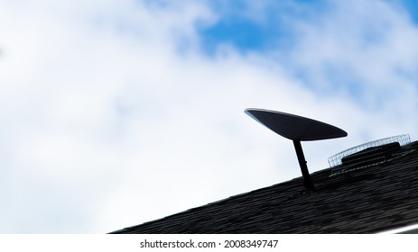 BRANT, CANADA - June 21, 2021: A Dark Silhouette Of A SpaceX Starlink Satellite Dish, An All-new Satellite Internet Constellation Service, Is Seen Mounted On The Roof Of A Home. 