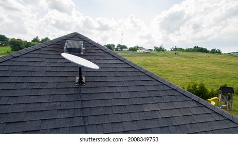 BRANT, CANADA - June 28, 2021: A SpaceX Starlink Satellite Dish Mounted On The Roof Of A Rural Home. Starlink Is An All-new Satellite Internet Constellation, One Of The First To The Public Market.